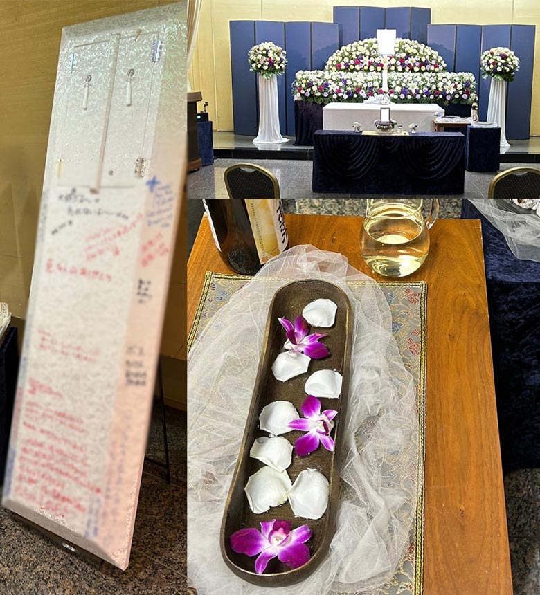 たくさんのメッセージが書かれた棺、白を基調とした花で作られた祭壇写真。